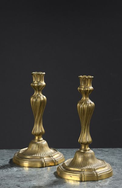 A pair of Louis XV period chased and gilded...
