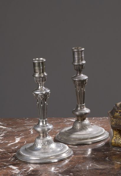 null A pair of silver candlesticks by Jean Mauzié, Paris 1734

With fluted shaft...