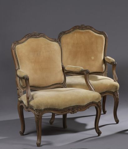  Pair of molded and carved wood armchairs...