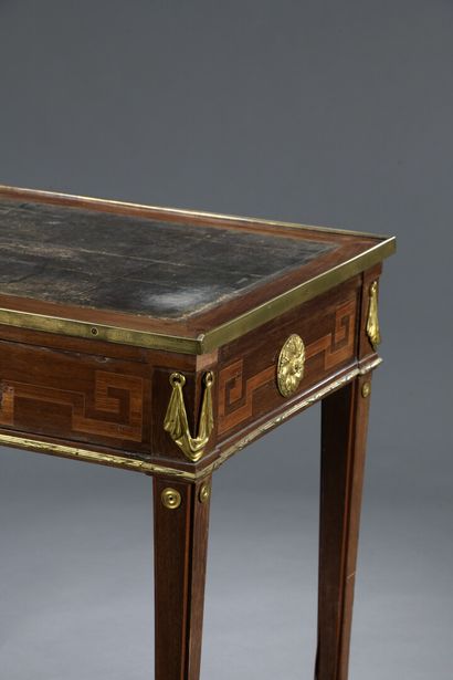 null A Transitional period rectangular veneered flat desk stamped Montigny and JME...