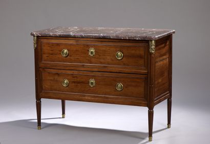 A mahogany and mahogany veneer chest of drawers...