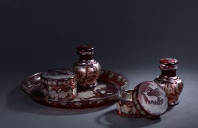 null Elements of a toiletry set in red Bohemian crystal cut with hunting decoration...