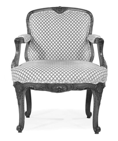 null A low armchair in moulded and carved wood from the beginning of the Louis XV...