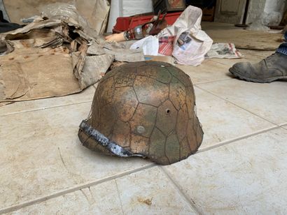 Camouflaged helmet with mesh.