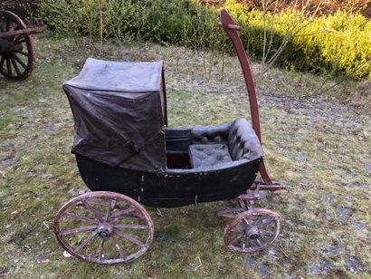 null Small four-wheeled children's carriage. 

Cradle body with hood.

Spring suspension...