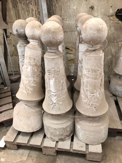 About fifty cement posts with the arms of...