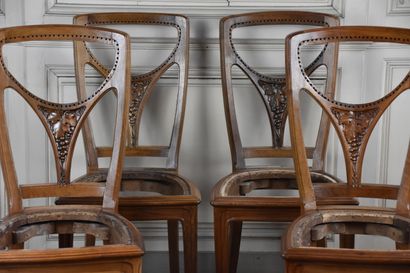 null 
Suite of four moulded and carved walnut chairs from the Art Nouveau period,...