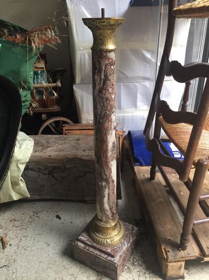 Column forming a saddle in red marble from...