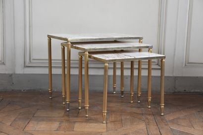 null Three Louis XVI style gilt bronze nesting tables 

Red veined white marble top...