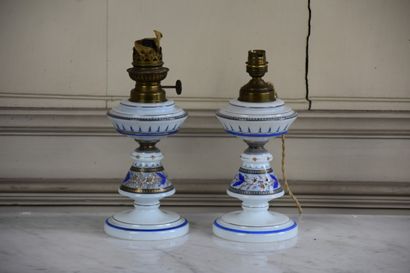 null A pair of Napoleon III period opaline lamps

With polychrome decoration of flowers...