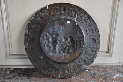 null A large brass offering plate in the 17th century style

Decorated with a tavern...