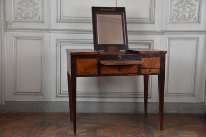 null A Louis XVI period rosewood and rosewood veneer dressing table, stamped J.POPSEL

Opening...