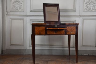 null A Louis XVI period rosewood and rosewood veneer dressing table, stamped J.POPSEL

Opening...