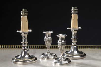 null Four Directoire style silver plated toilet candlesticks

H. 14 and 12,5 cm