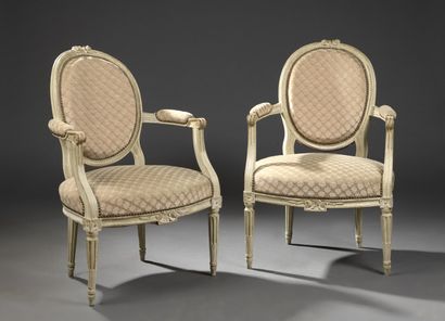 null A pair of Louis XVI period moulded and carved wooden armchairs

With medallion...