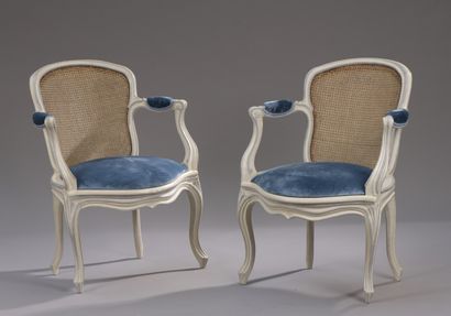 null A pair of Louis XV period moulded, carved and lacquered cabriolet armchairs...