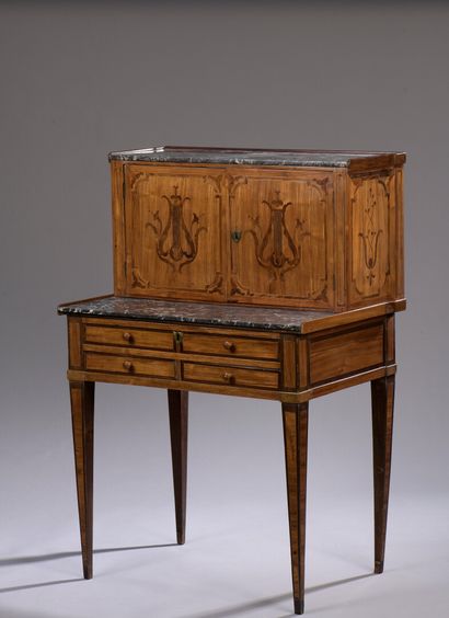 null Rosewood veneer Bonheur du jour, late 18th century

It opens at the top with...