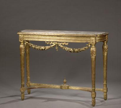 null A Louis XVI style carved and gilded wood console, 20th century

It rests on...