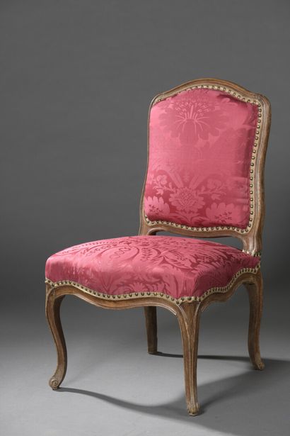 null A Louis XV period moulded wood chair stamped Nq Foliot.

It stands on cambered...