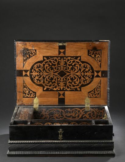 null A late 17th century blackened wood, ebony, cedar and pink marble box

The tray...