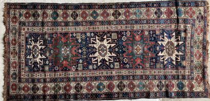 TAPIS CAUCASE CAUCASUS RUG with star patterns on a midnight blue background with...