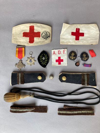 [MILITARIA]. LOT [MILITARIA]. LOT comprising 

- Two red cross armbands and an ADF...