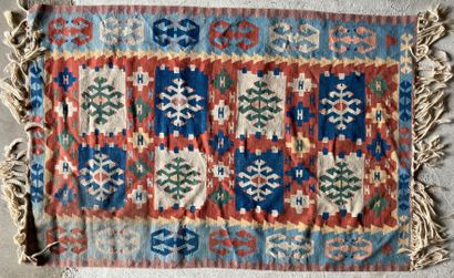 TAPIS KILIM KILIM RUG with geometrical patterns on a red background with blue border....