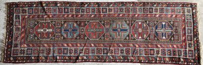 TAPIS GALERIE GALLERY RUG with geometric patterns on a brown background with four...