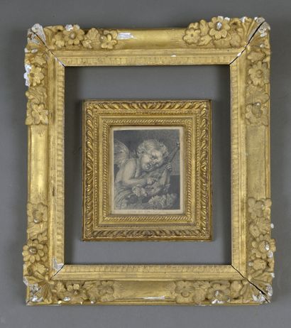 null A Louis XIV period carved and gilded wood frame

Decorated with leafy spandrels,...