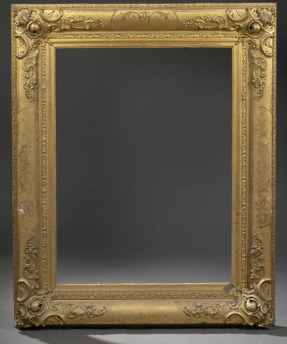 null A Napoleon III period molded, carved and gilded wood frame

Decorated with staples...