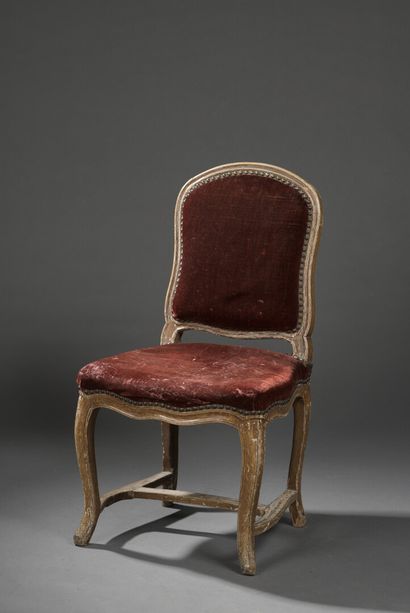 null A Louis XV period moulded wood chair stamped P. Malbet.

It rests on cambered...