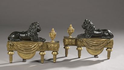  A pair of Louis XVI period gilt bronze and patinated and engraved andirons attributed...