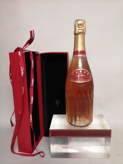  A bottle of CHAMPAGNE VRANKEN " Cuvée Cartier " Brut rosé 
In a slightly damaged...