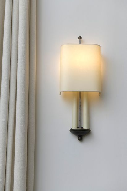 null Pair of sconces with two lights

In metal in brass and patinated steel, in the...