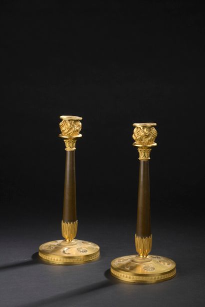 null Pair of chased, patinated and gilt bronze torches, early Empire period

The...