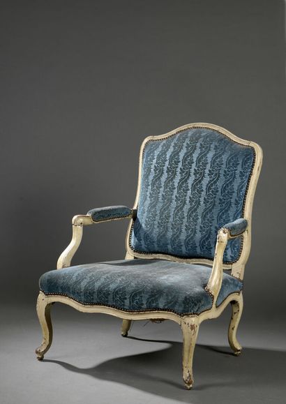 null Low armchair in molded and carved wood by Foliot from the Louis XV period

With...