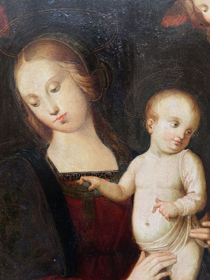  Dans le goût du PERUGIN 
Vierge à l'Enfant entourée de deux séraphins 
Panneau parqueté....