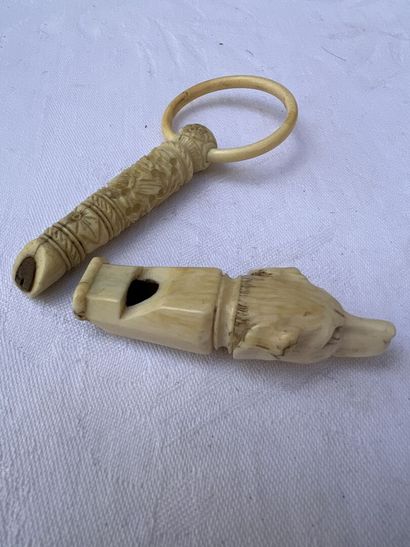 null Set of two bone and ivory whistles, XIXth century

One carved with friezes,...