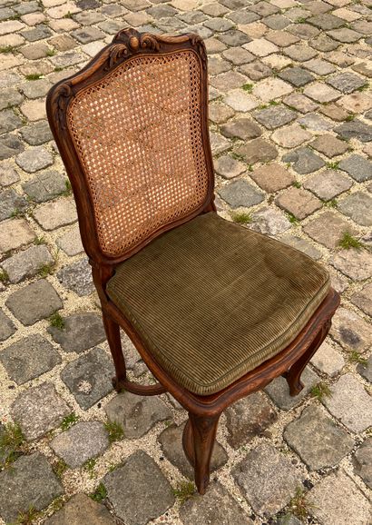 null Pair of caned chairs in molded and carved wood in the Louis XV style

With a...
