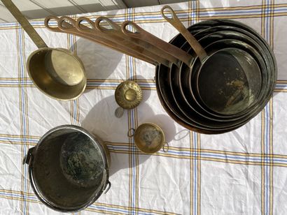 null Lot of brassware including a set of pans, a ladle and miscellaneous.