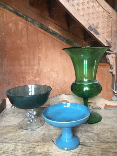 null Two glass and blue earthenware fruit cups.

20th century 

A green glass Medici...