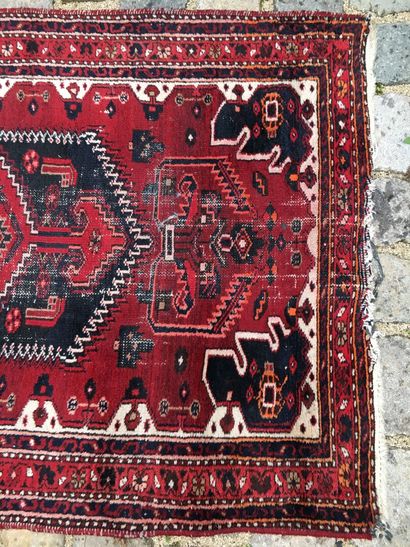 null CAUCASE XXth century

Woolen carpet with geometrical decorations on red background...