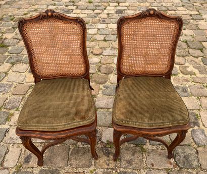 null Pair of caned chairs in molded and carved wood in the Louis XV style

With a...