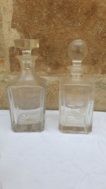 null Set of four whiskey decanters and various glasses.