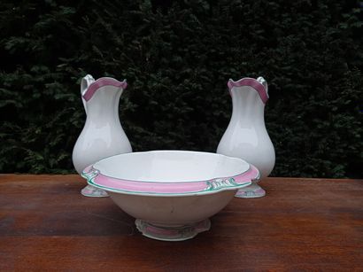null Two ewers and a bowl in glazed earthenware, 20th century.

With green and pink...