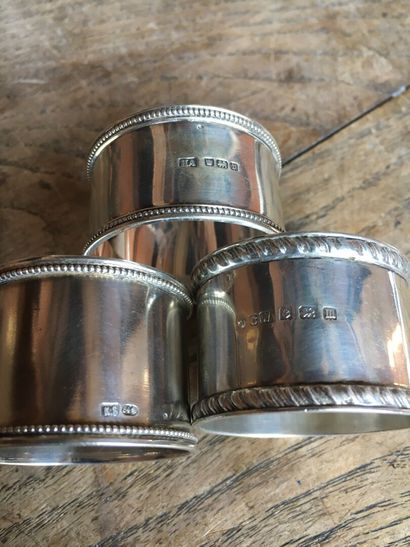 null Lot of five silver goblets.

Three silver napkin rings and a silver sugar tongs...