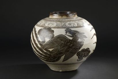 null Large vase in the Cizhou style

CHINA

The globular body, decorated with phoenix...