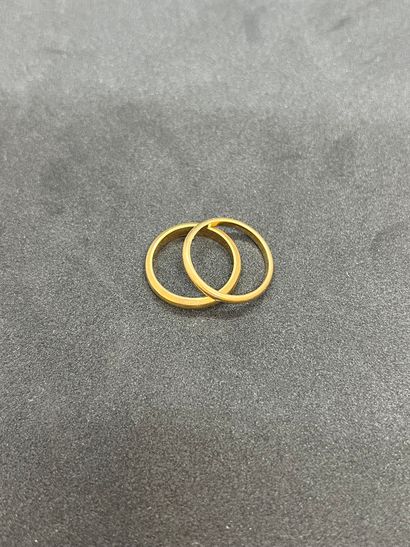 null Two wedding rings in 18K gold 750‰. 

Total gross weight 7.62 g