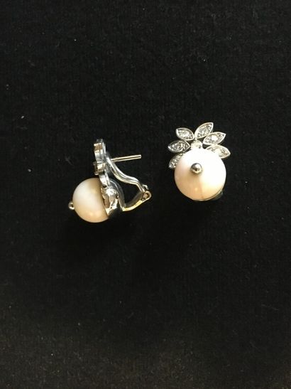 Pair of ear clips adorned with a ball of...