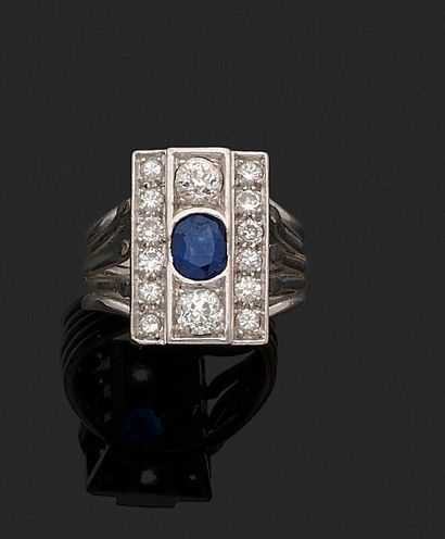 null Ring with an oval sapphire (chips) between two main diamonds and two lines of...
